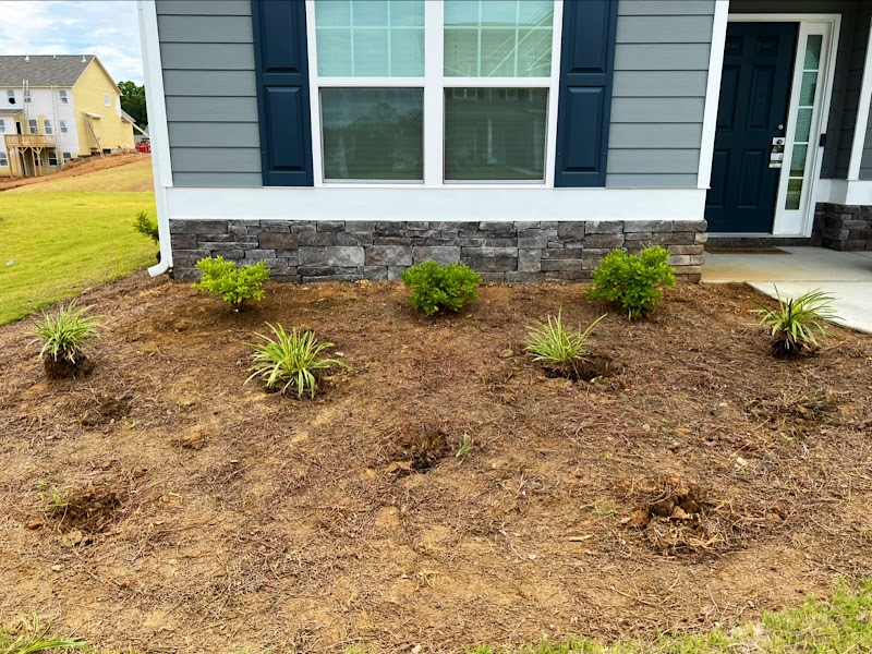 Pena Lawn Services landscaping work along house foundation