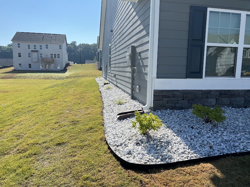 White rock border installation by Pena Lawn Services